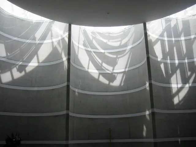 Daylight cast across the curved chapel interior
